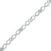 Previously Owned - 0.10 CT. T.W. Diamond Infinity Ribbon Link Bracelet in Sterling Silver - 7.25"