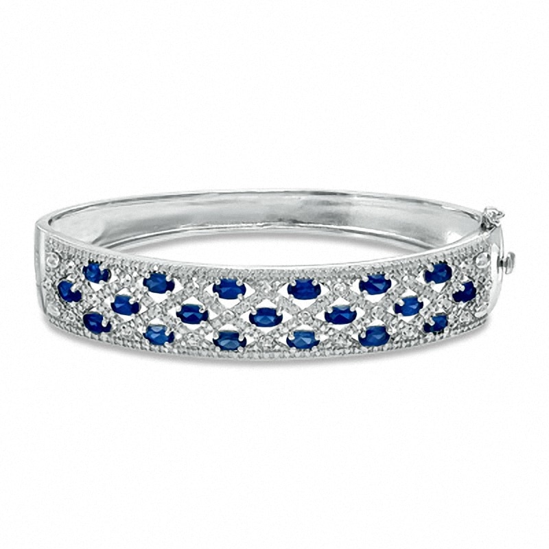 Main Image 1 of Previously Owned - Oval Lab-Created Blue Sapphire and Diamond Accent Bangle in Sterling Silver - 7.25&quot;