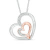Previously Owned - 0.12 CT. T.W. Diamond Double Heart Pendant in Sterling Silver and 14K Rose Gold Plate