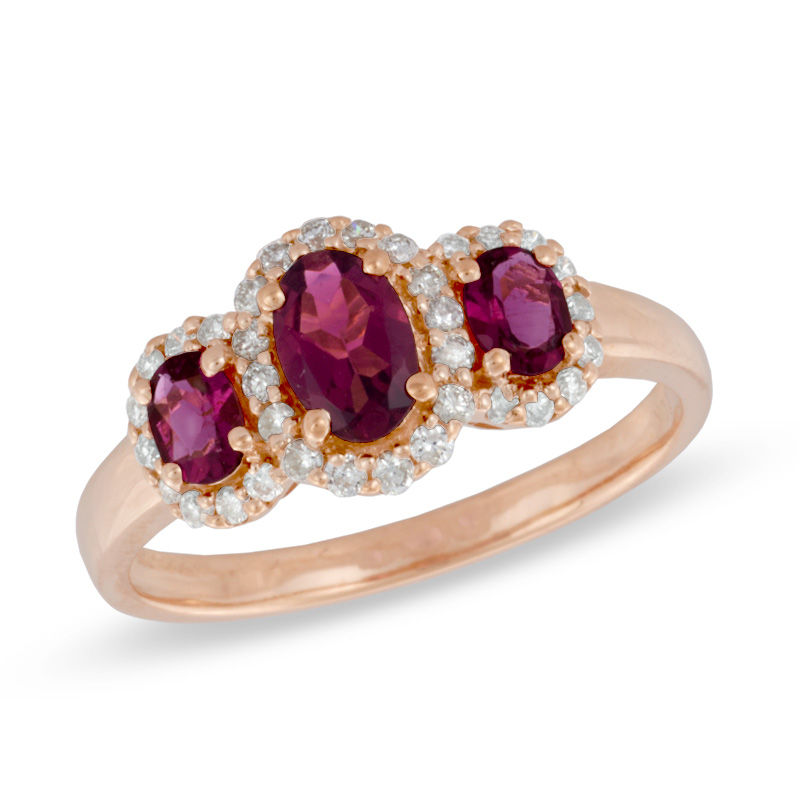 Previously Owned - Oval Rubellite and 0.23 CT. T.W. Diamond Three Stone Ring in 10K Rose Gold