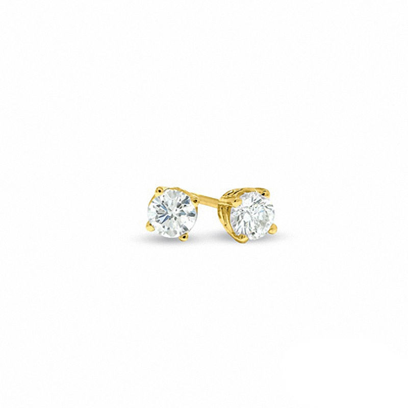 Previously Owned - 0.20 CT. T.W.   Diamond Solitaire Tension-Set Earrings in 14K Gold (I/I2)