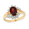 Thumbnail Image 0 of Previously Owned - Oval Garnet and Diamond Accent Ring in 10K Gold