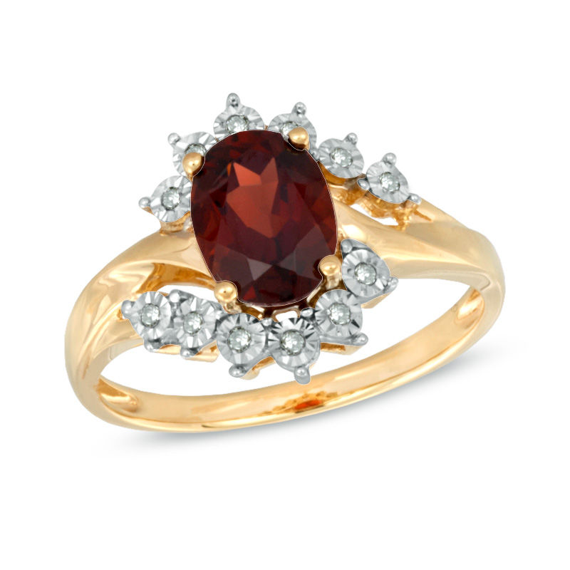 Previously Owned - Oval Garnet and Diamond Accent Ring in 10K Gold