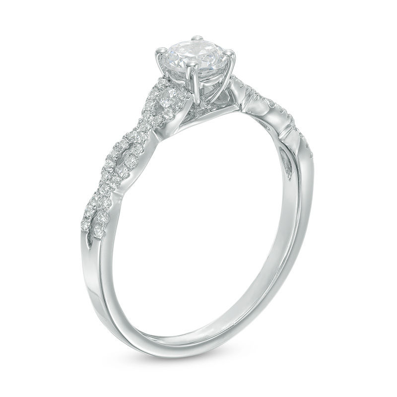 Previously Owned - Celebration  LuxÂ® 0.63 CT. T.W. Diamond Twist Shank Engagement Ring in 14K White Gold (I/SI2)