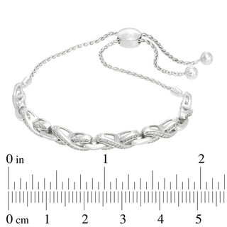 Previously Owned - 0.20 CT. T.W. Diamond "X" Bolo Bracelet in Sterling Silver - 9.5"