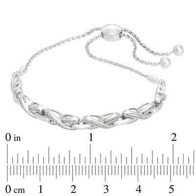 Previously Owned - 0.20 CT. T.W. Diamond "X" Bolo Bracelet in Sterling Silver - 9.5"