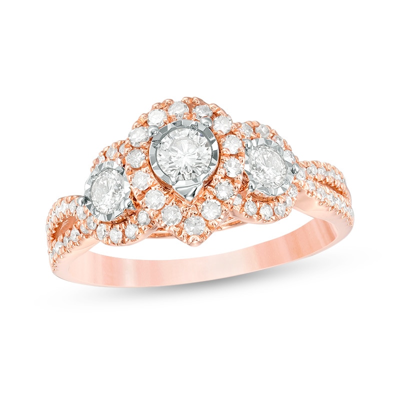 Previously Owned - 0.70 CT. T.W. Diamond Past Present Future® Pear-Shaped Frame Twist Engagement Ring in 10K Rose Gold