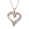 Previously Owned - 0.25 CT. T.W. Baguette and Round Diamond Heart Pendant in 10K Rose Gold