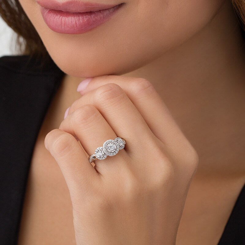 Previously Owned - 0.50 CT. T.W. Diamond Past Present Future® Frame Twist Engagement Ring in 10K White Gold