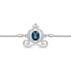 Previously Owned - Enchanted Disney Cinderella Oval Blue Topaz and 0.085 CT. T.W. Diamond Carriage Bolo Bracelet