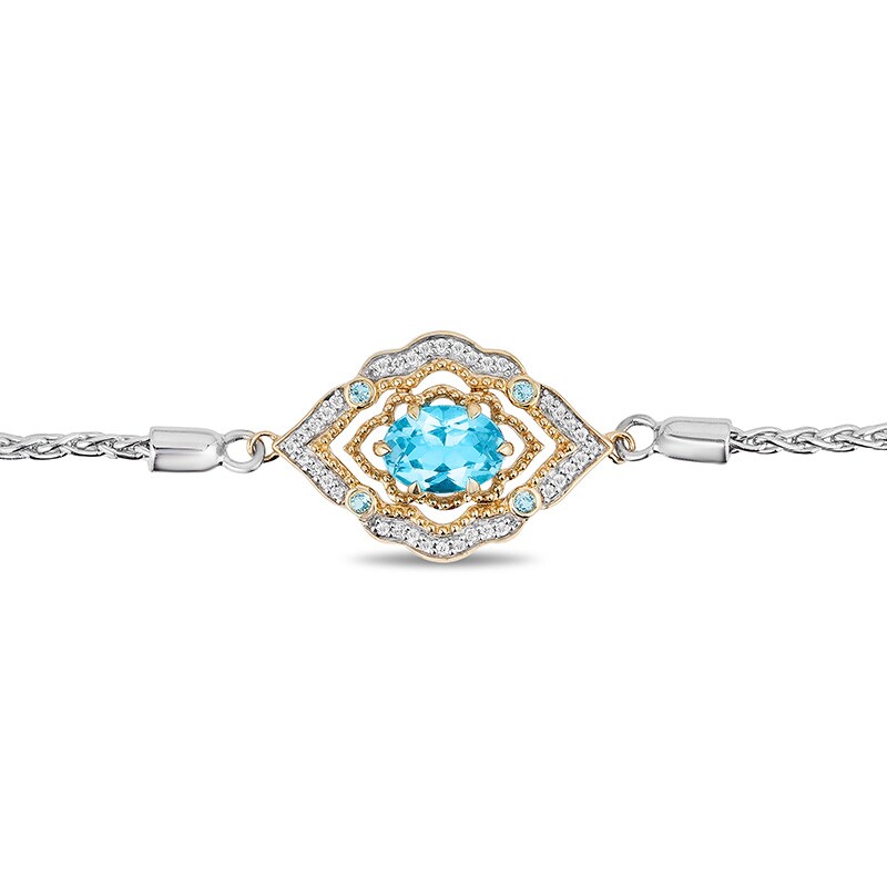 Previously Owned - Enchanted Disney Aladdin Oval Swiss Blue Topaz and 0.065 CT. T.W. Diamond Bolo Bracelet