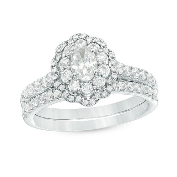 Previously Owned - 1.00 CT. T.W. Oval Diamond Double Scallop Frame Bridal Set in 14K White Gold