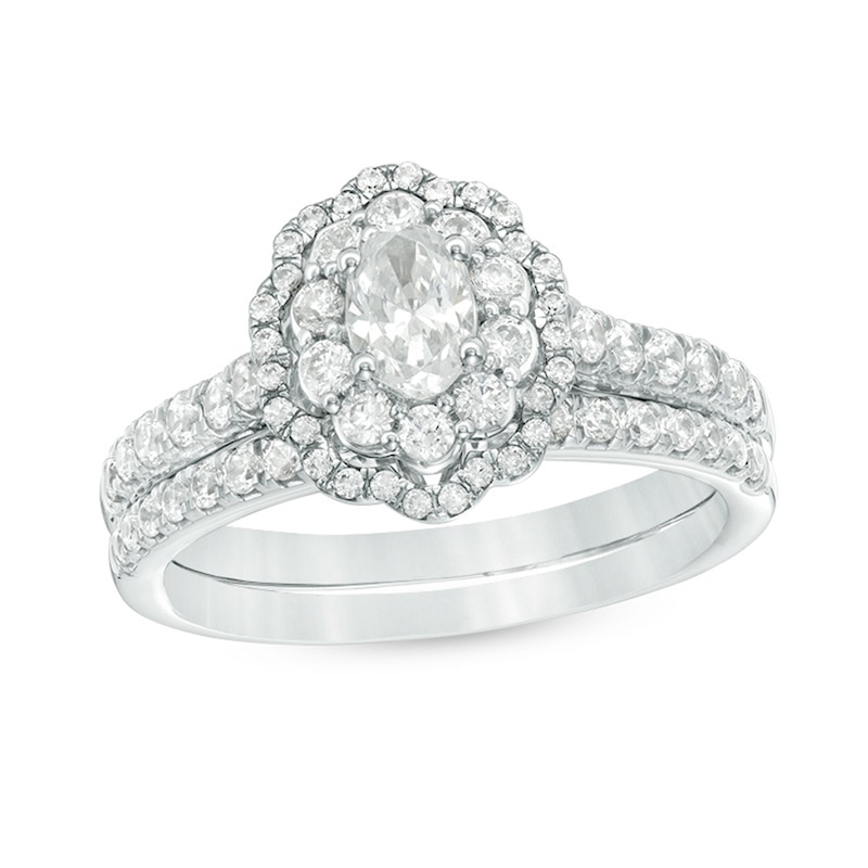 Main Image 1 of Previously Owned - 1.00 CT. T.W. Oval Diamond Double Scallop Frame Bridal Set in 14K White Gold