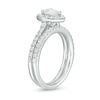 Previously Owned - 1.25 CT. T.W. Pear-Shaped Diamond Frame Bridal Set in 14K White Gold