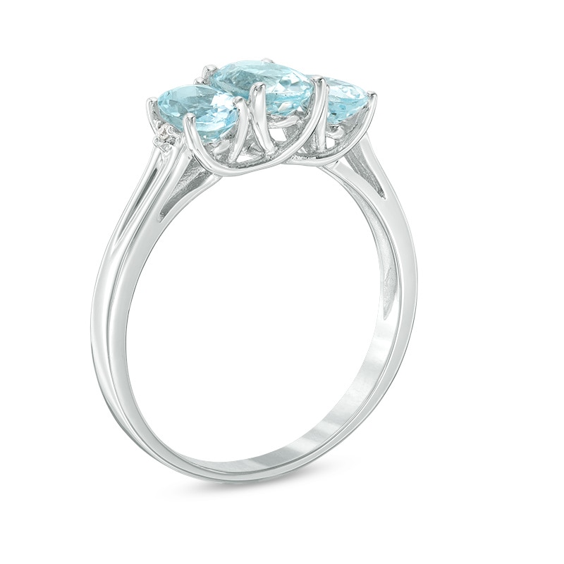 Previously Owned - Oval Aquamarine and Diamond Accent Three Stone Ring in 10K White Gold