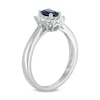 Previously Owned - Oval Blue Sapphire and 0.18 CT. T.W. Diamond Starburst Frame Ring in 10K White Gold