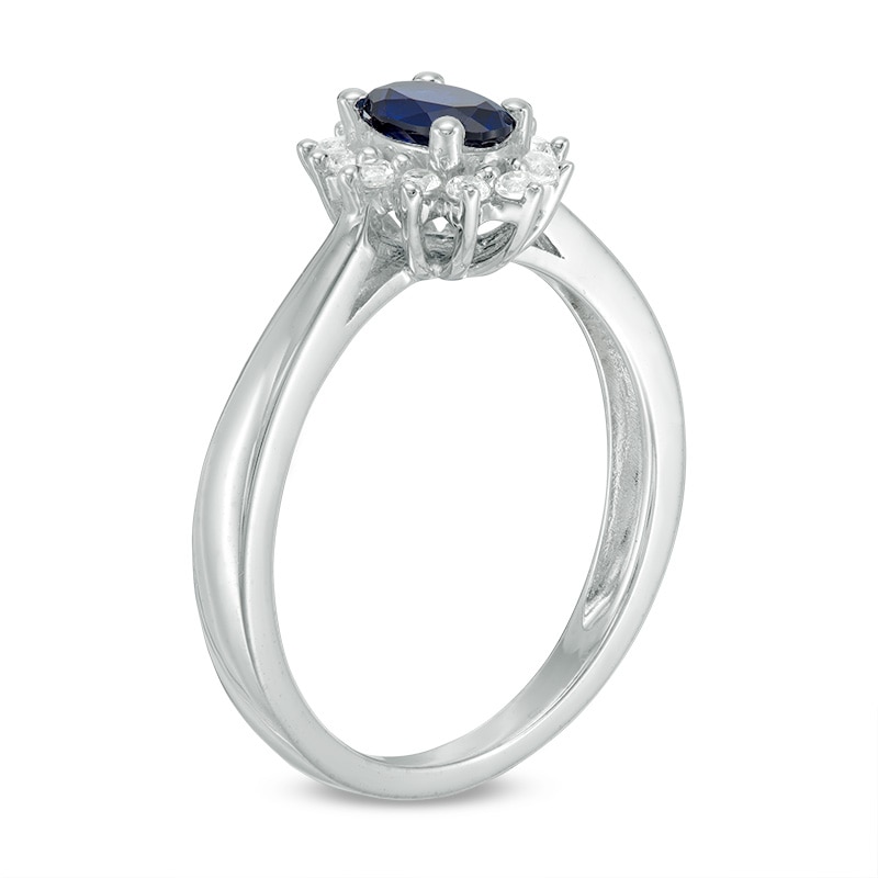 Previously Owned - Oval Blue Sapphire and 0.18 CT. T.W. Diamond Starburst Frame Ring in 10K White Gold