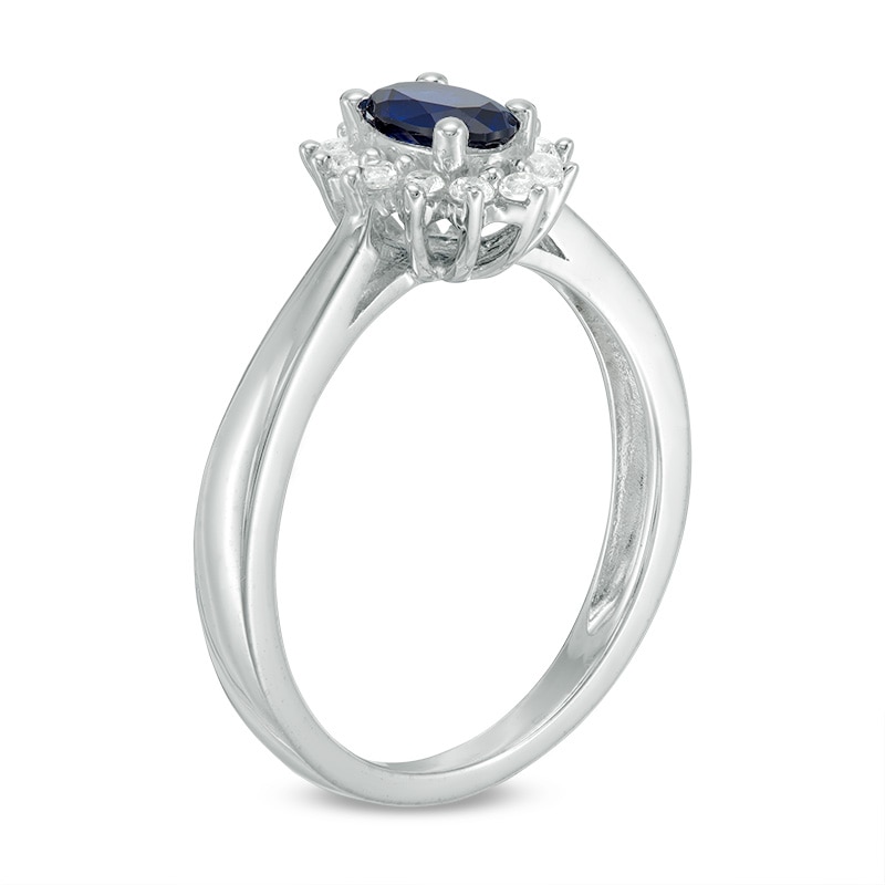 Previously Owned - Oval Blue Sapphire and 0.18 CT. T.W. Diamond Starburst Frame Ring in 10K White Gold|Peoples Jewellers