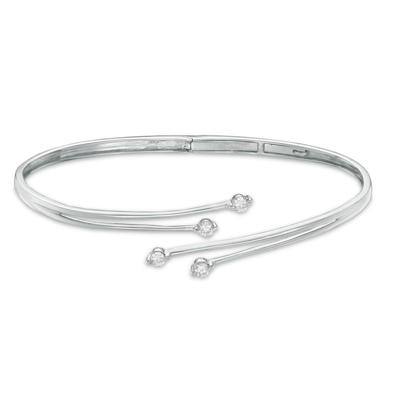 Previously Owned - 0.33 CT. T.W. Diamond Four Stone Bypass Bangle in 10K White Gold
