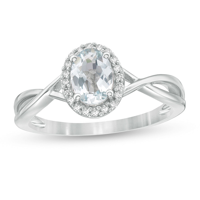 Previously Owned - Oval Aquamarine and 0.08 CT. T.W. Diamond Frame Twist Shank Ring in 10K White Gold