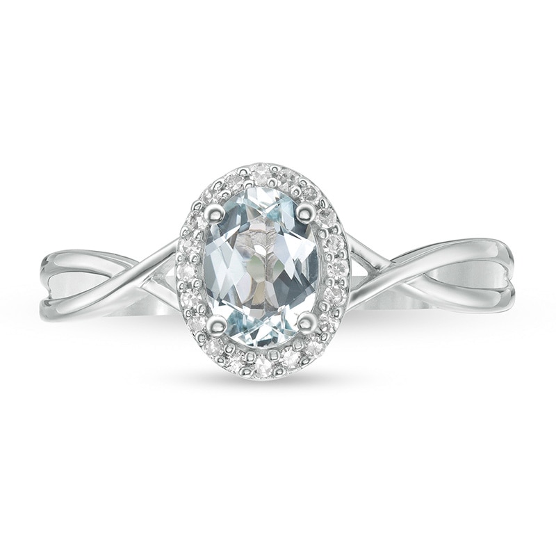 Previously Owned - Oval Aquamarine and 0.08 CT. T.W. Diamond Frame Twist Shank Ring in 10K White Gold