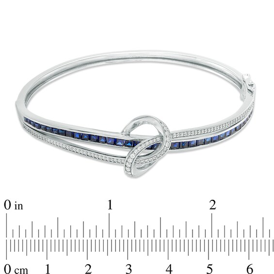 Previously Owned - Princess-Cut Lab-Created Blue and White Sapphire Loose Knot Bangle in Sterling Silver