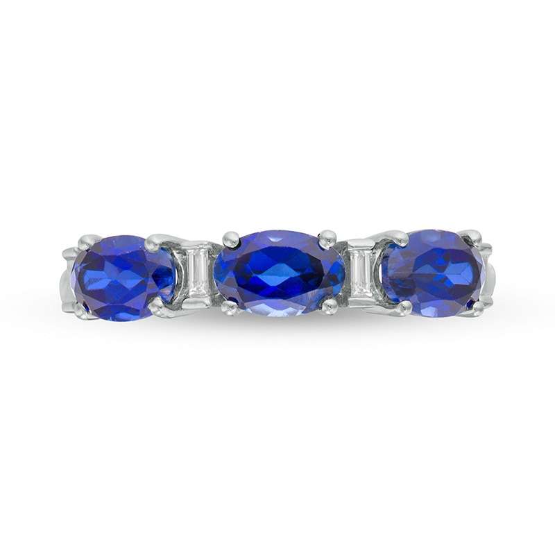 Previously Owned - Oval Lab-Created Blue Sapphire and Baguette Diamond Accent Three Stone Ring in Sterling Silver