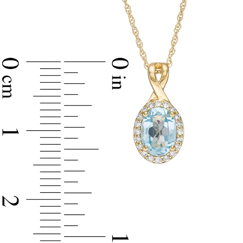 Previously Owned - Oval Swiss Blue Topaz and 0.08 CT. T.W. Diamond Frame Twisted Split Bail Pendant in 10K Gold