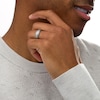 Thumbnail Image 1 of Previously Owned - Men's 0.24 CT. T.W. Diamond Stepped Edge Comfort-Fit Wedding Band in Stainless Steel and Tungsten