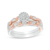Thumbnail Image 1 of Previously Owned - 0.10 CT. T.W. Composite Diamond Frame Twist Ribbon Interlocking Bridal Set in 10K Two-Tone Gold