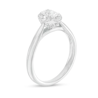Previously Owned - 0.62 CT. T.W. Oval Diamond Frame Engagement Ring in 14K White Gold (I/I2)