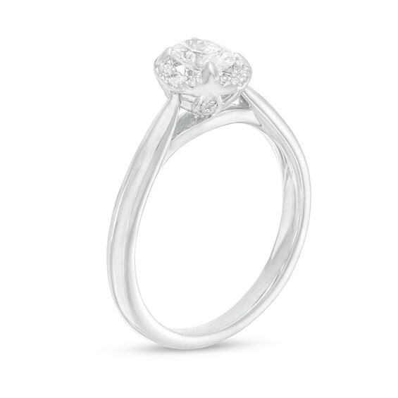 Previously Owned - 0.62 CT. T.W. Oval Diamond Frame Engagement Ring in 14K White Gold (I/I2)