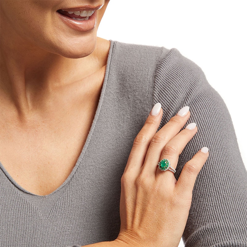 Previously Owned - Oval Emerald and 0.25 CT. T.W. Diamond Double Scallop Frame Ring in 10K Gold