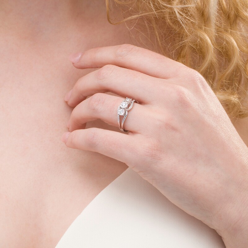 Previously Owned - 0.25 CT. T.W. Diamond Past Present Future® Bypass Split Shank Engagement Ring in 10K White Gold