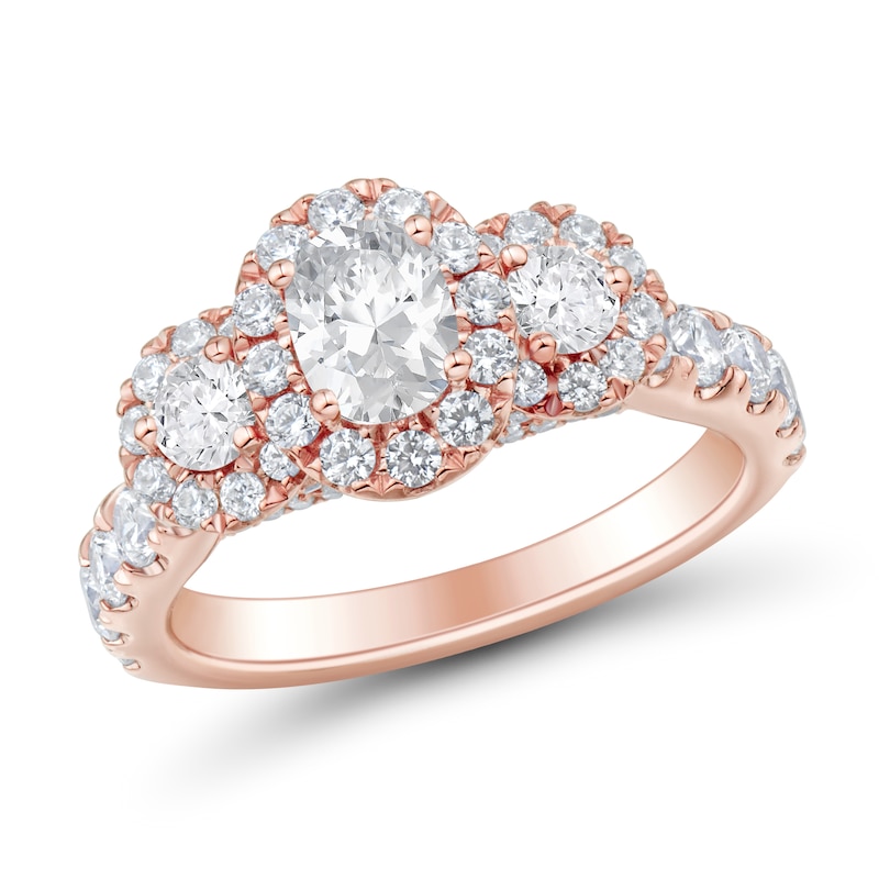 Previously Owned - 1.95 CT. T.W. Oval and Round Diamond Frame Three Stone Engagement Ring in 14K Rose Gold