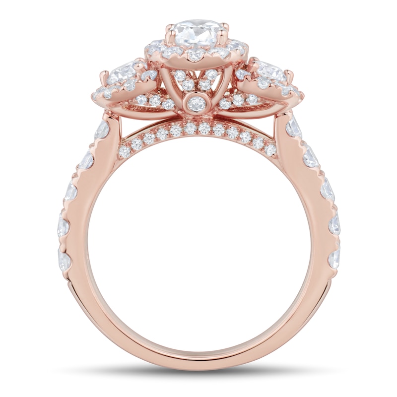Previously Owned - 1.95 CT. T.W. Oval and Round Diamond Frame Three Stone Engagement Ring in 14K Rose Gold