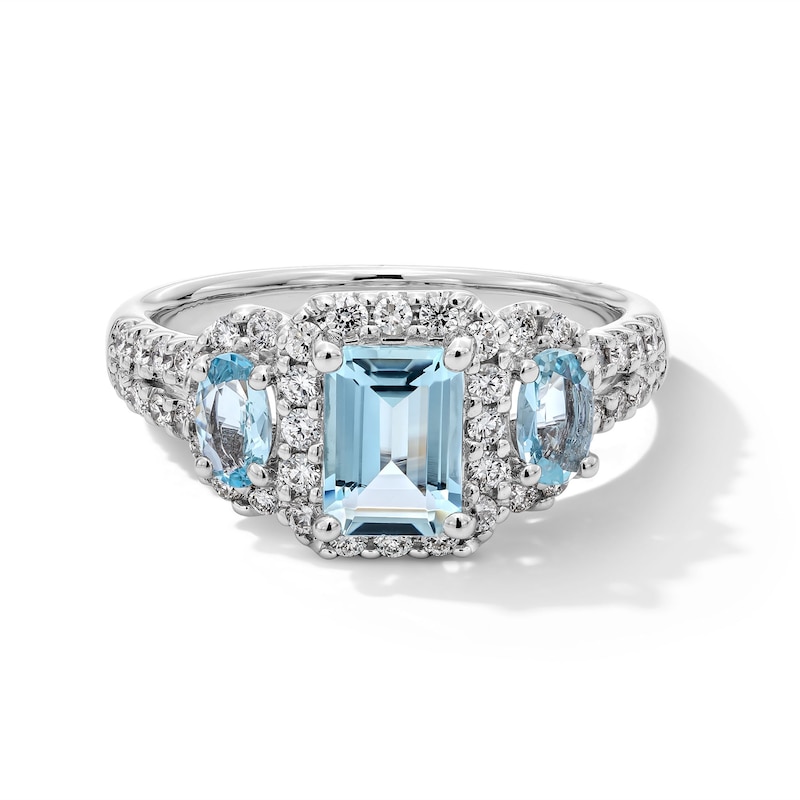 Previously Owned - Emerald-Cut and Oval Aquamarine with 0.45 CT. T.W. Diamond Frame Three Stone Ring in 10K White Gold
