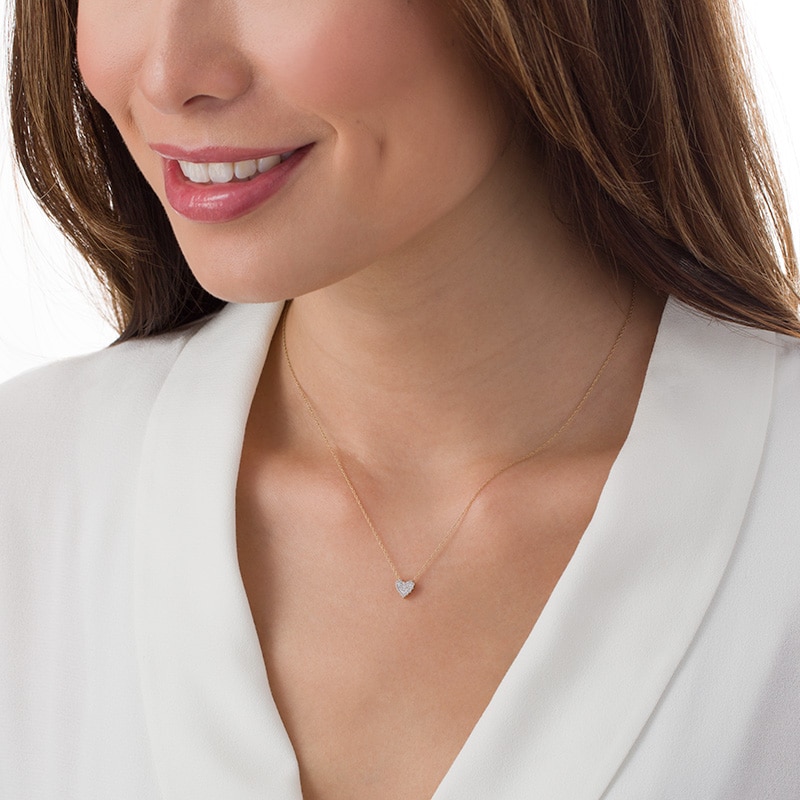 Previously Owned - 0.10 CT. T.W. Multi-Diamond Heart Pendant in 10K Gold
