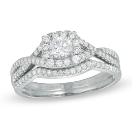 Previously Owned - 0.70 CT. T.W. Certified Canadian Diamond Twist Shank Bridal Set in 14K White Gold (I/I1)