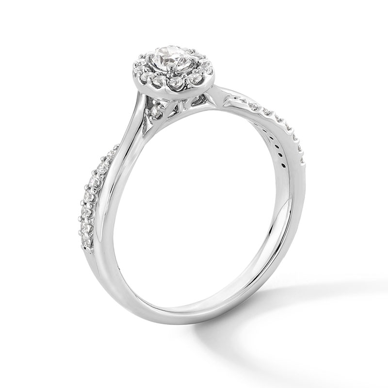 Previously Owned - 0.30 CT. T.W. Oval Lab-Grown Diamond Frame Crossover Shank Promise Ring in Sterling Silver (F/VS2)