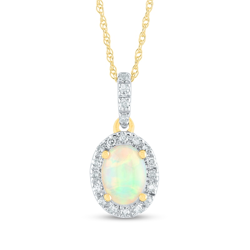 Previously Owned - Oval Opal and 0.12 CT. T.W. Diamond Frame Drop Pendant in 14K Gold