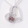 4.0mm Heart-Shaped Garnet and Diamond Accent Tilted "LOVE" Pendant in Sterling Silver