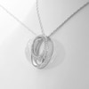 0.117 CT. T.W. Diamond Spiral Open Circle Pendant in Sterling Silver