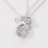 0.04 CT. T.W. Diamond Love Knot Dog Paw Print Pendant in Sterling Silver