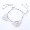 0.065 CT. T.W. Diamond Open Circle Paw Print Bolo Bracelet in Sterling Silver and 10K Rose Gold - 9.5"