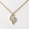 0.23 CT. T.W. Diamond Channel-Set Solitaire Bypass Flame Pendant and Stud Earrings Set in 10K Gold