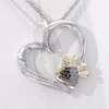 0.115 CT. T.W. Enhanced Black and White Diamond Paw Print Heart Pendant in Sterling Silver and 10K Gold