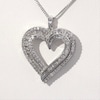 0.95 CT. T.W. Baguette and Round Diamond Double Row Heart Pendant in 10K Gold