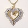 0.95 CT. T.W. Diamond Double Row Heart Pendant in 10K Gold