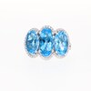 Oval Swiss Blue Topaz and 0.149 CT. T.W. Diamond Frame Trio Ring in 10K White Gold